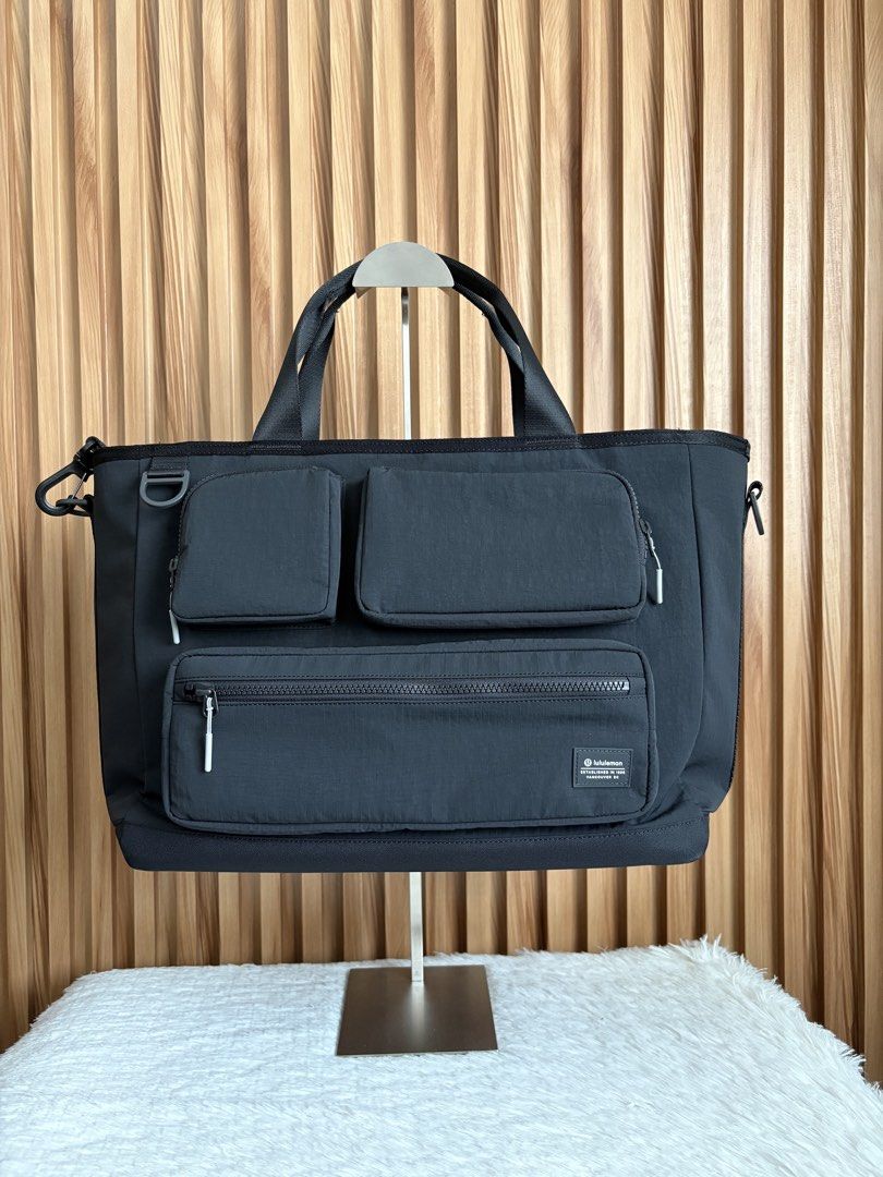 LULULEMON MULTI-POCKET TOTE BAG 19.5L (Category: Tote Bags) located in Imus. Submitted by dumpitlikeaqueen (Listing ID 1467233286, Image 1). Description: • Bag only; detachable pouch included • Open for layaway • Instagram Shop: @dumpitlikeaqueen.