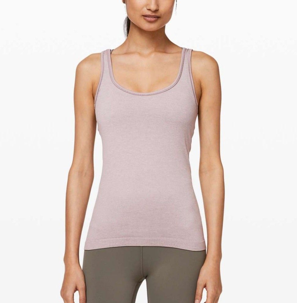 Lululemon Seek Simplicity Tank top (Category: Sleeveless) located in Bayambang. Submitted by mon10192816 (Listing ID 1467257817, Image 1). Description: - Width 15 - Length 24 - Brand: Lululemon - Texture: Ribbed knit with small reflective omega logo on lower left hem - Fit & Fabric: Standard fit, breathable, and stretchable - Condition: Excellent for workouts or casual daily wear.