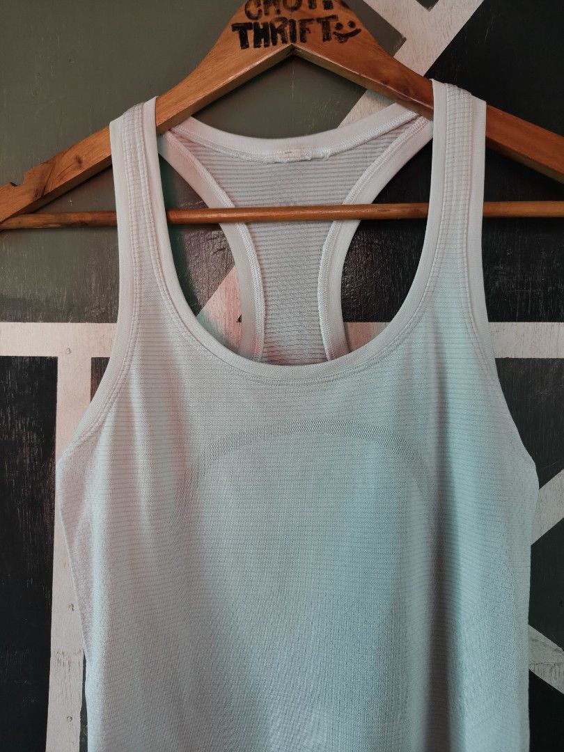 Lululemon Swiftly Tech Racerback Tank Top Light Blue (Category: Activewear) located in Manila. Submitted by choycleverdeer.f04b80 (Listing ID 1467329762, Image 3). Description: - Brand: Lululemon - Color: Light blue - Design: Seamless ribbed fabric with a racerback cut and signature logo on the back neckline - Material: Lightweight, breathable, and stretchy for ultimate comfort - Versatility: Ideal for running, gym workouts, or casual daily wear.