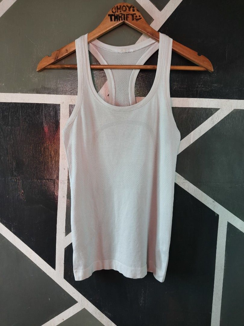 Lululemon Swiftly Tech Racerback Tank Top Light Blue (Category: Activewear) located in Manila. Submitted by choycleverdeer.f04b80 (Listing ID 1467329762, Image 1). Description: - Brand: Lululemon - Color: Light blue - Design: Seamless ribbed fabric with a racerback cut and signature logo on the back neckline - Material: Lightweight, breathable, and stretchy for ultimate comfort - Versatility: Ideal for running, gym workouts, or casual daily wear.