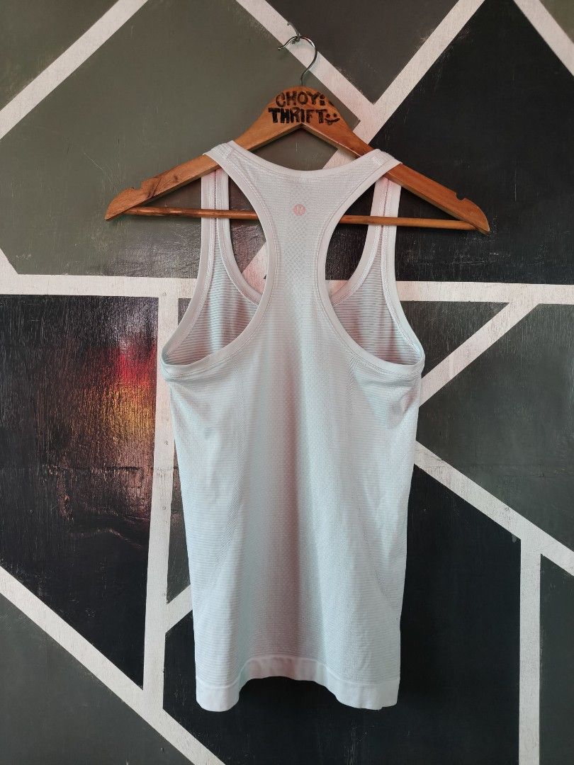 Lululemon Swiftly Tech Racerback Tank Top Light Blue (Category: Activewear) located in Manila. Submitted by choycleverdeer.f04b80 (Listing ID 1467329762, Image 2). Description: - Brand: Lululemon - Color: Light blue - Design: Seamless ribbed fabric with a racerback cut and signature logo on the back neckline - Material: Lightweight, breathable, and stretchy for ultimate comfort - Versatility: Ideal for running, gym workouts, or casual daily wear.