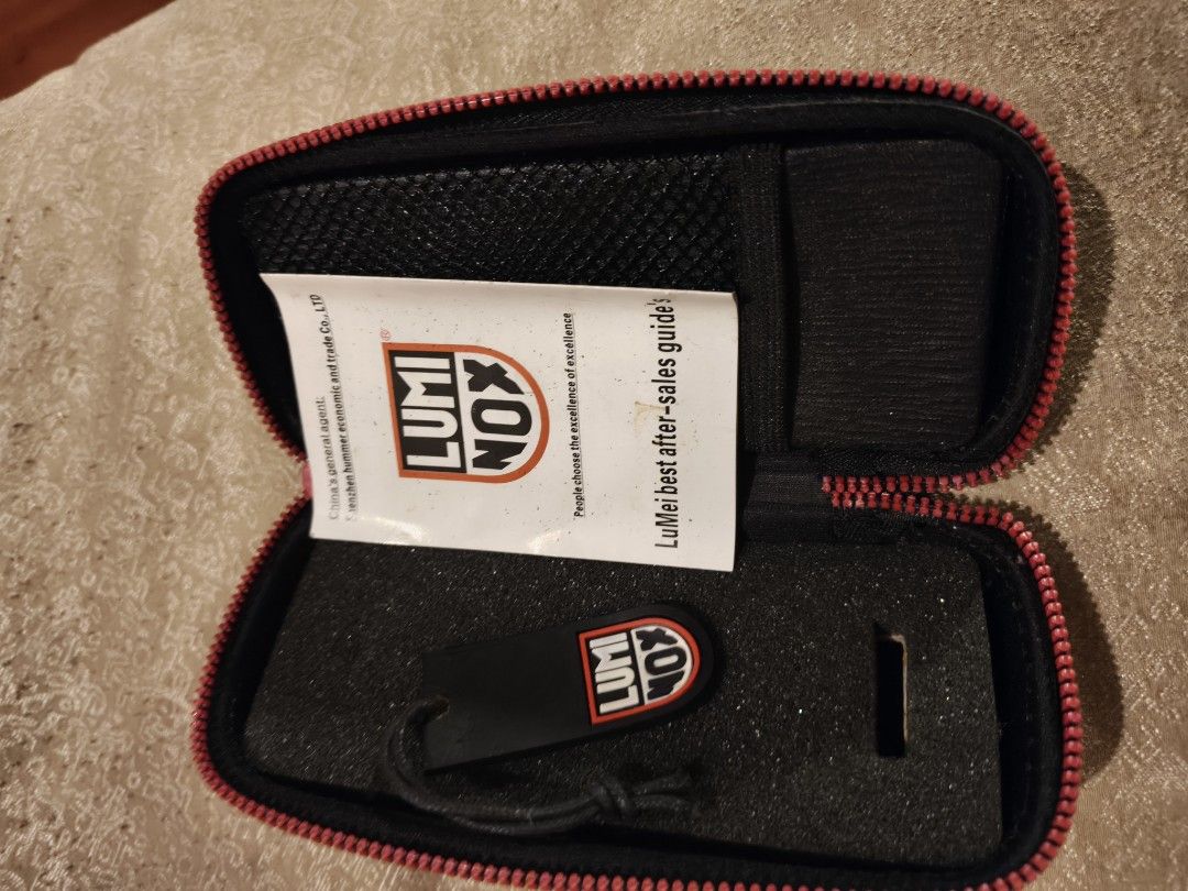 Luminox Watch Case with Tag and Guide (Category: Accessory Holder, Box & Organizers) located in Manila. Submitted by bravefox_31b6f5 (Listing ID 1467283618, Image 2). Description: - Brand: Luminox - Color: Black with red trim - Protection: Durable hard shell exterior with custom foam padding - Storage: Convenient interior mesh pocket for small accessories - Inclusions: Original tag and LuMei after-sales guide booklet included prefered pick up: An