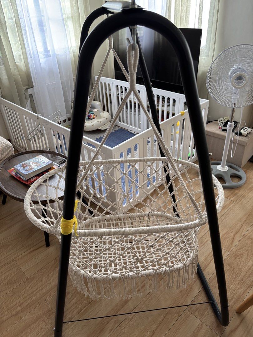 Macrame Baby Swing with Black Metal Stand (Category: Cots & Cribs) located in Pasig City. Submitted by cessjane12 (Listing ID 1467310759, Image 2). Description: - Stylish macrame baby swing with a sturdy black metal frame - Cozy white woven cotton basket featuring cute bottom fringe - Securely suspended hanging rope design -Duyan/kuna - Compact, freestanding structure perfect for living rooms or nurseries - Neutral colors effortlessly match any h