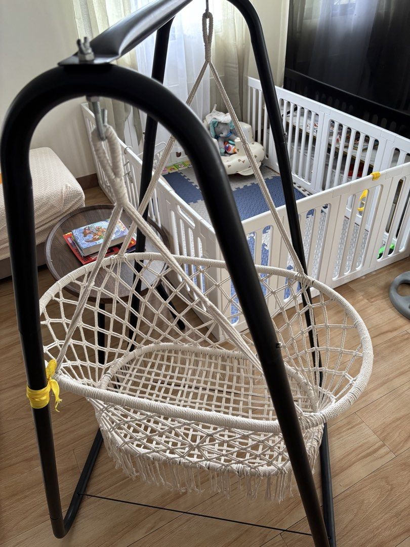 Macrame Baby Swing with Black Metal Stand (Category: Cots & Cribs) located in Pasig City. Submitted by cessjane12 (Listing ID 1467310759, Image 1). Description: - Stylish macrame baby swing with a sturdy black metal frame - Cozy white woven cotton basket featuring cute bottom fringe - Securely suspended hanging rope design -Duyan/kuna - Compact, freestanding structure perfect for living rooms or nurseries - Neutral colors effortlessly match any h