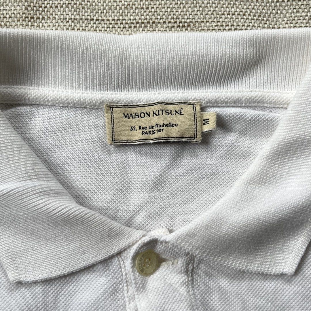 Maison Kitsune Double Fox Head Polo Shirt (Category: Tshirts & Polo Shirts ) located in Panabo. Submitted by curated.dept (Listing ID 1467275877, Image 2). Description: size medium 20.5 width, 29 length excellent condition 9/10 color rate very unnoticeable washable stain no major flaws.