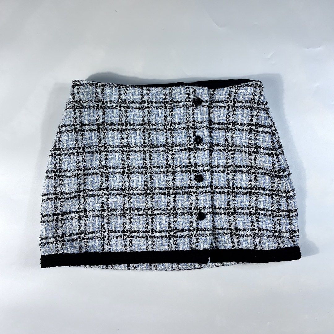 Maje Jizuli Checked Tweed Mini Skirt (Category: Activewear) located in Iloilo. Submitted by profitpicks (Listing ID 1467354124, Image 1). Description: Measurement: W’ 26 | L’ 14 Maje Jizuli Checked Tweed Mini Skirt (also referred to as a tweed mini skort), featuring a blue and black check pattern, offset front buttons, and a bottom velvet or braided trim..