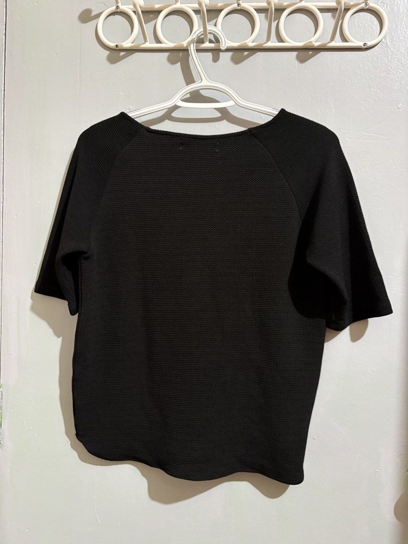 Maldita Black Textured Top Size S (Category: Blouses) located in Manila. Submitted by margascloset_ (Listing ID 1467299797, Image 2). Description: Maldita Black Small Blouse - can fit up to small-medium - Style: Short sleeves, round neckline, curved hemline - Fabric: Textured waffle-like material - Condition: Clean, no flaws .