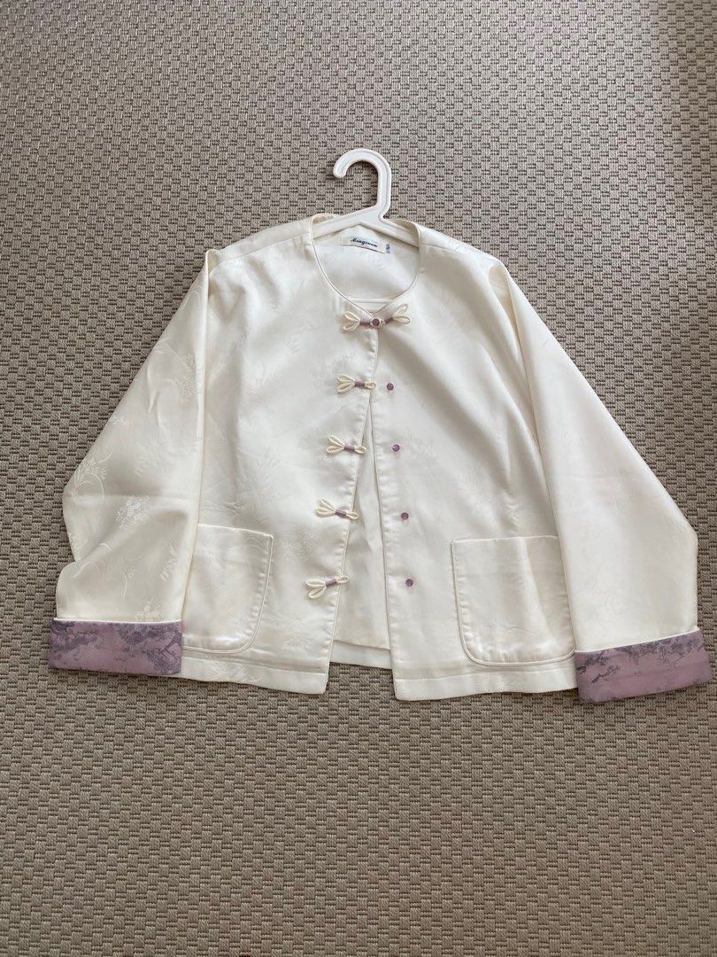 Mandarin / Chinese Collar Jacket (Category: Coats, Jackets and Outerwear) located in Pasig City. Submitted by misscsj (Listing ID 1467189837, Image 1). Description: - Brand/Style: Mingxuan silk blouse - Color: Off-white with floral jacquard pattern - Details: Traditional front frog closures with purple accents and matching purple sleeve cuffs - Features: Two convenient front patch pockets - Size: S (tag at collar) - Occasion: Great for cultural e