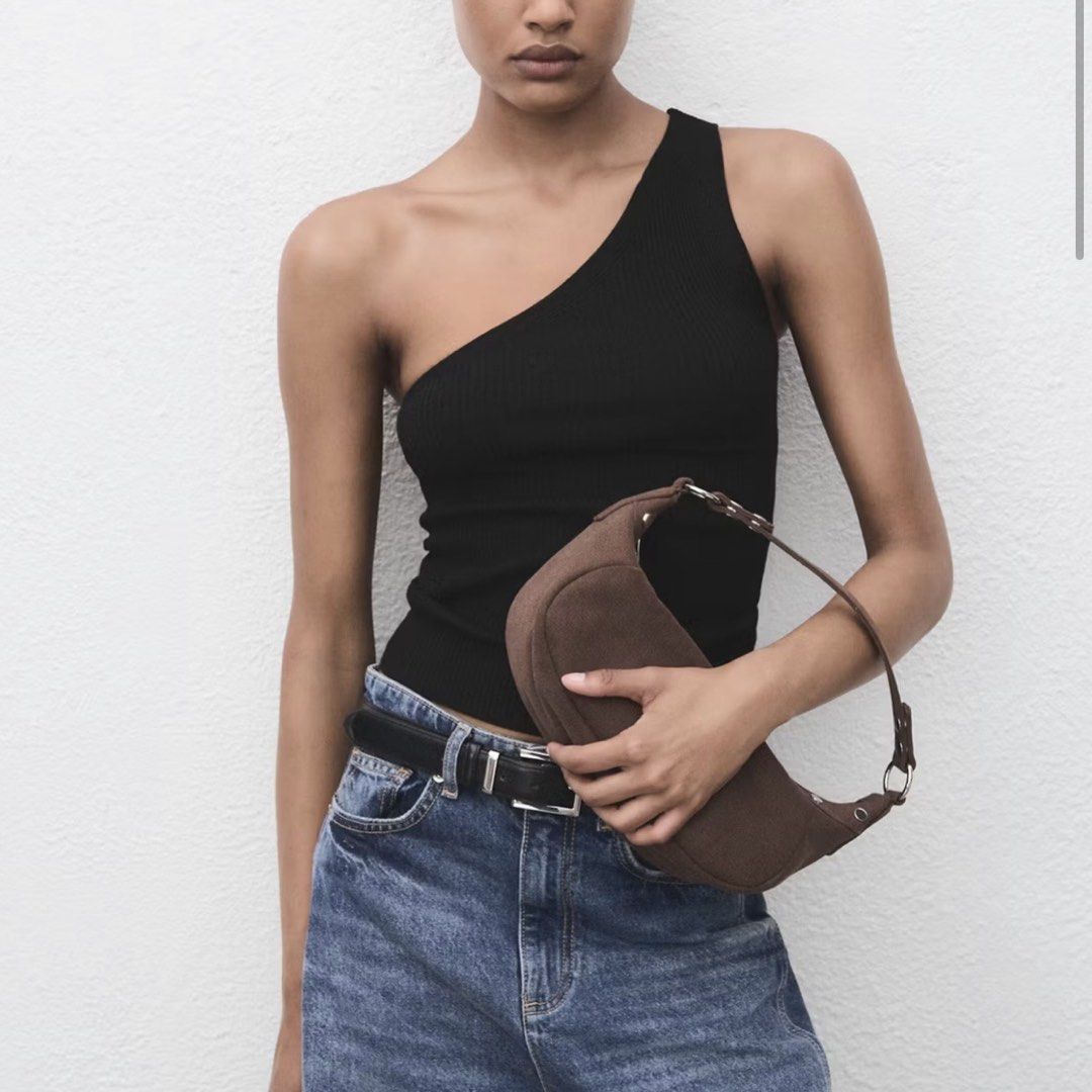 Mango Black Knit Asymmetric Top (Category: Sleeveless) located in Taguig. Submitted by riyahkh (Listing ID 1467305627, Image 1). Description: Black One-Shoulder Ribbed Tank Top. Fit: Slim fit, stretchy knit fabric. Clean, great staple for casual days or night outs! Fits XS-S Helping Tags: Zara, Bershka, Cotton On, H&M, Pull&Bear, Stradivarius.