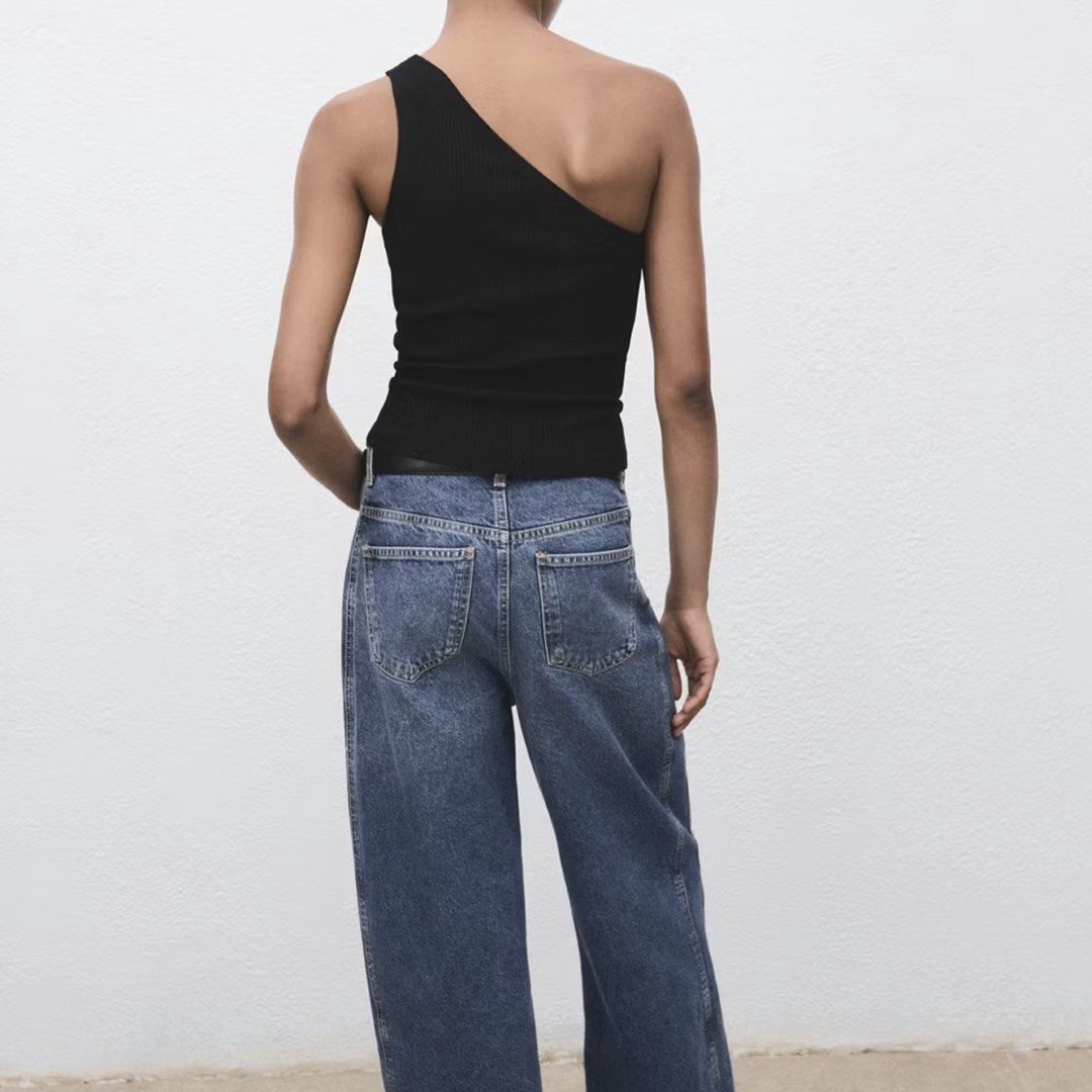 Mango Black Knit Asymmetric Top (Category: Sleeveless) located in Taguig. Submitted by riyahkh (Listing ID 1467305627, Image 3). Description: Black One-Shoulder Ribbed Tank Top. Fit: Slim fit, stretchy knit fabric. Clean, great staple for casual days or night outs! Fits XS-S Helping Tags: Zara, Bershka, Cotton On, H&M, Pull&Bear, Stradivarius.