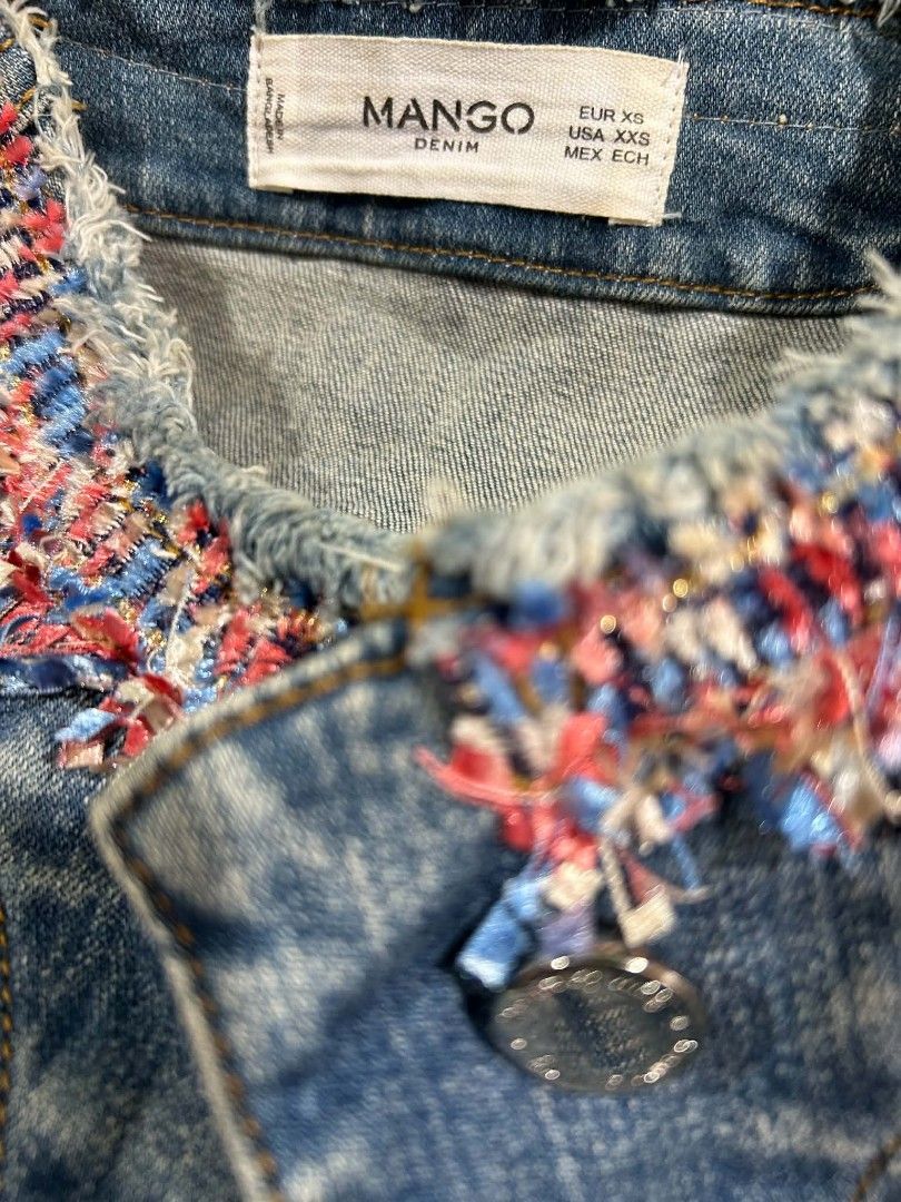 Mango denim jacket (Category: Coats, Jackets and Outerwear) located in Davao. Submitted by 07dward (Listing ID 1467356308, Image 2). Description: collarless denim blue jacket with lace, button closure, straight hem the model is 5'7 wearing small top of the line are.