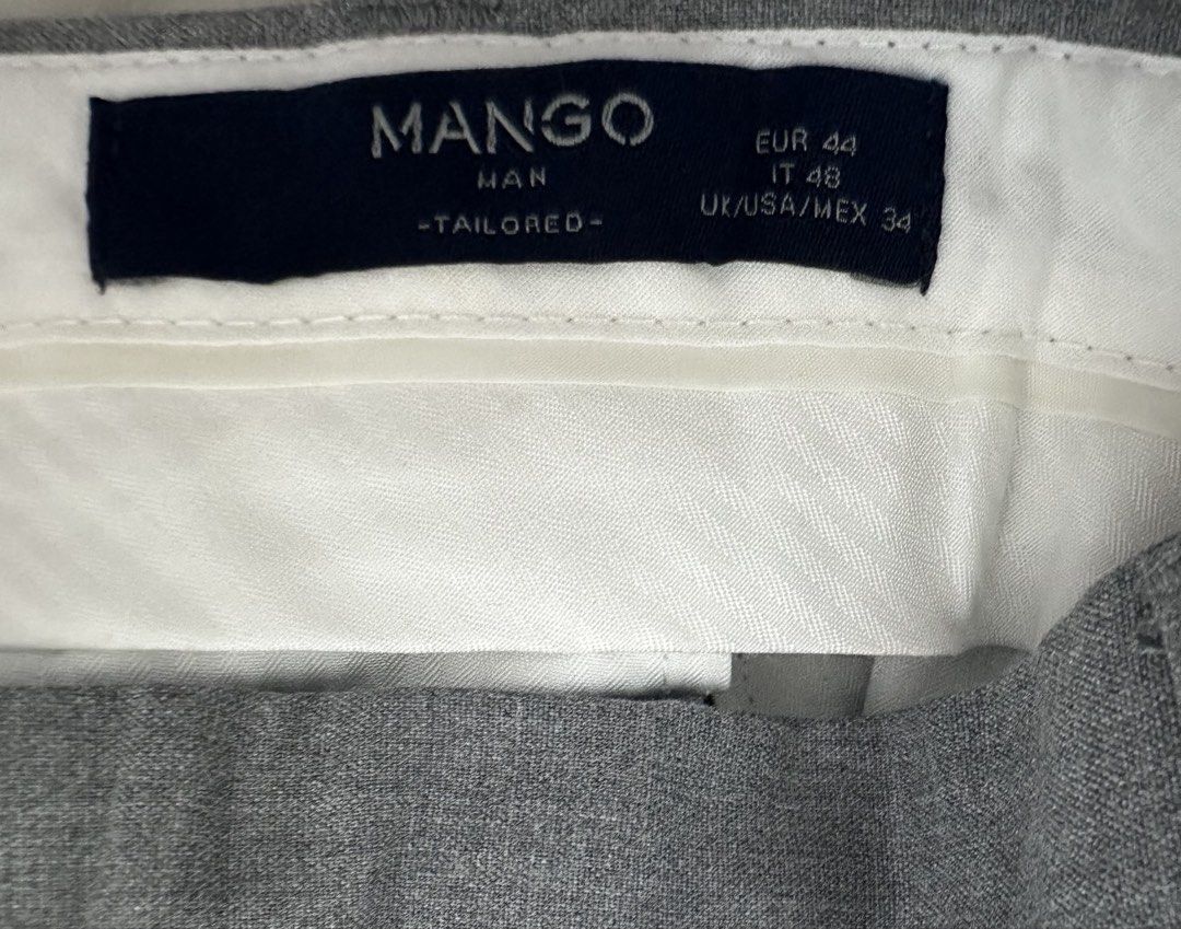 Mango Man Tailored Grey Trousers Size 34 (Category: Trousers) located in Quezon City. Submitted by aussomefinds (Listing ID 1467203969, Image 2). Description: - Brand: Mango Man Tailored - Size: EUR 44 / IT 48 / US/UK/MEX 34 - Color: Classic Grey - Fit: Standard straight leg cut with a clean waistline and belt loops - Closure: Single button - Fabric: Smooth, lightweight, and comfortable - Condition: Excellent, ready for a new owner - Perfect for: