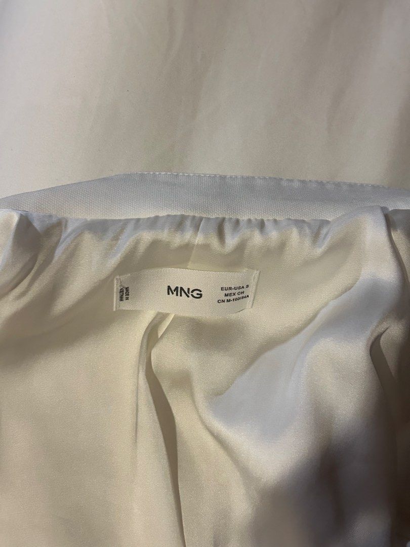 Mango White Blazer Size S (Category: Coats, Jackets and Outerwear) located in Cebu City. Submitted by shopmikascloset (Listing ID 1467293890, Image 2). Description: Worn twice only, still in like new condition. - Brand: Mango - Size: S - Color: White - Style: Buttonless front drape with sharp lapels and structured shoulders - Fabric: Smooth finish with a clean back seam - Versatile: Easy to layer over shirts or dresses for work and casual outings