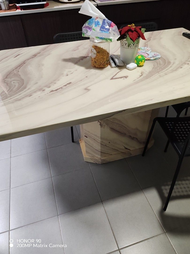 Marble pattern dining table with solid central base (Category: Tables & Sets) located in Singapore. Submitted by uesm31 (Listing ID 1467319886, Image 2). Description: - Rectangular dining table with a chic pink and white marble-look top - Sturdy solid central support block matching the tabletop design - Smooth, glossy finish that is easy to wipe clean after meals - Spacious surface that fits multiple chairs comfortably - Neutral tones designed to