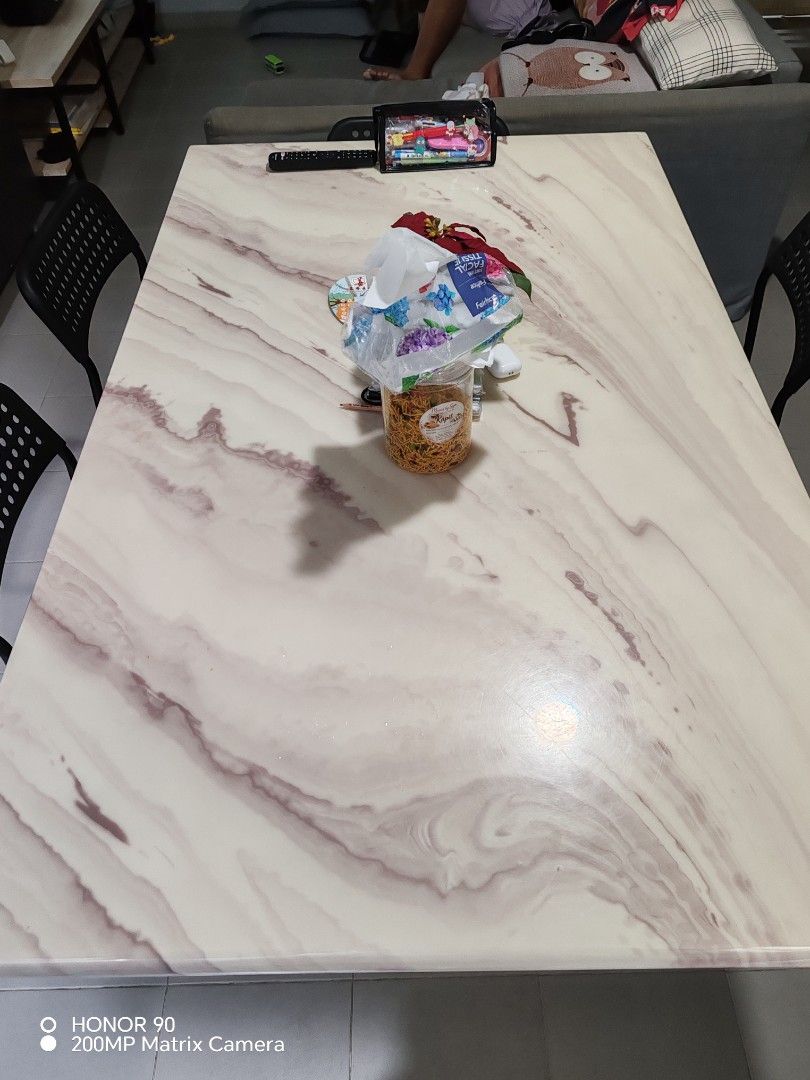 Marble pattern dining table with solid central base (Category: Tables & Sets) located in Singapore. Submitted by uesm31 (Listing ID 1467319886, Image 1). Description: - Rectangular dining table with a chic pink and white marble-look top - Sturdy solid central support block matching the tabletop design - Smooth, glossy finish that is easy to wipe clean after meals - Spacious surface that fits multiple chairs comfortably - Neutral tones designed to