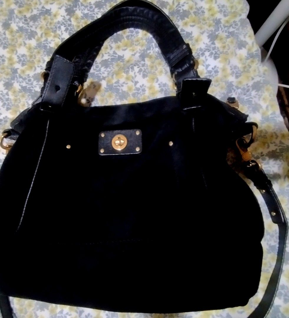 Marc by Marc Jacobs Black Suede Handbag (Category: Cross-body Bags) located in Manila. Submitted by lene48 (Listing ID 1467278967, Image 1). Description: - Brand: Marc by Marc Jacobs - Material: Premium black suede with gold-tone hardware - Closure: Secure turnlock plate on the front exterior pocket - Carrying Options: Dual top handles and a detachable shoulder strap - Interior: Stylish black and white patterned fabric lining with a convenient zi