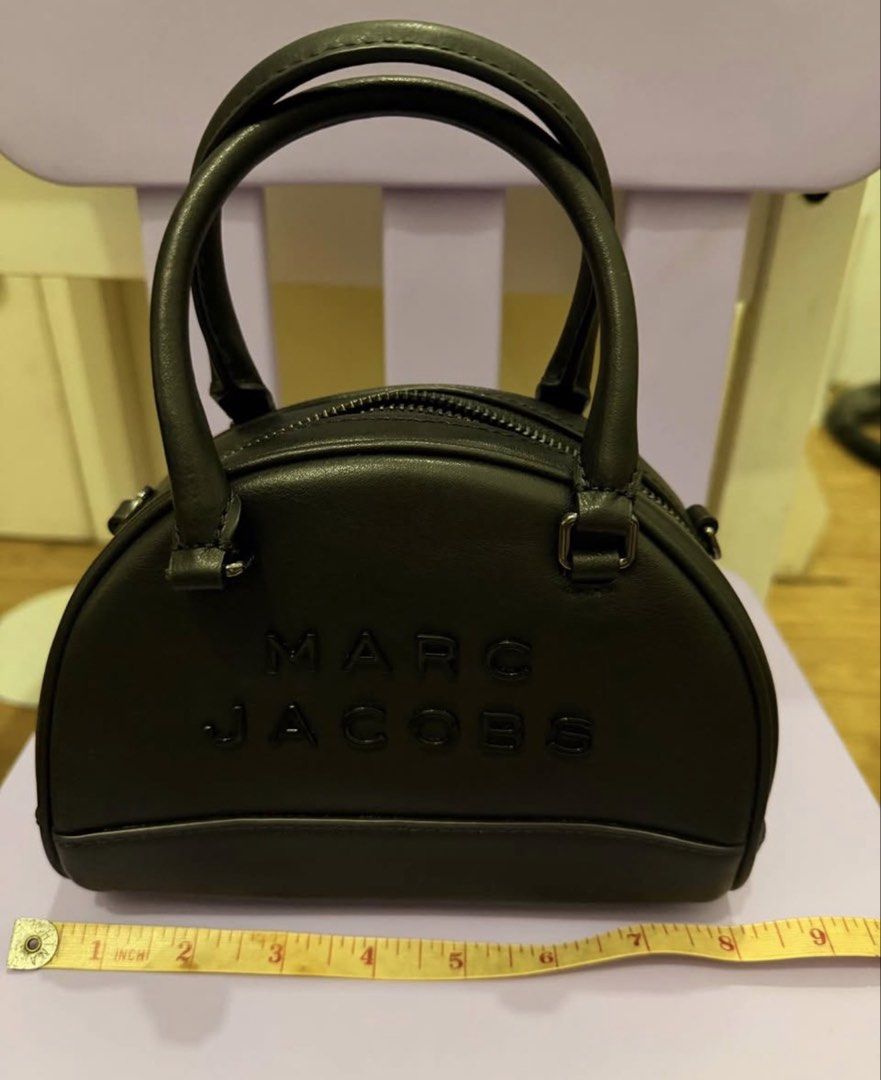 Marc Jacobs Bowling Bag (Category: Luxury Bags & Wallets) located in Manila. Submitted by 08sophia (Listing ID 1467232321, Image 2). Description: Marc Jacobs Bowling Bag. Black. No flaws. 100% good as new. 100% authentic. Bought in Marc Jacobs Outlet store in SFO. Kasya promax..