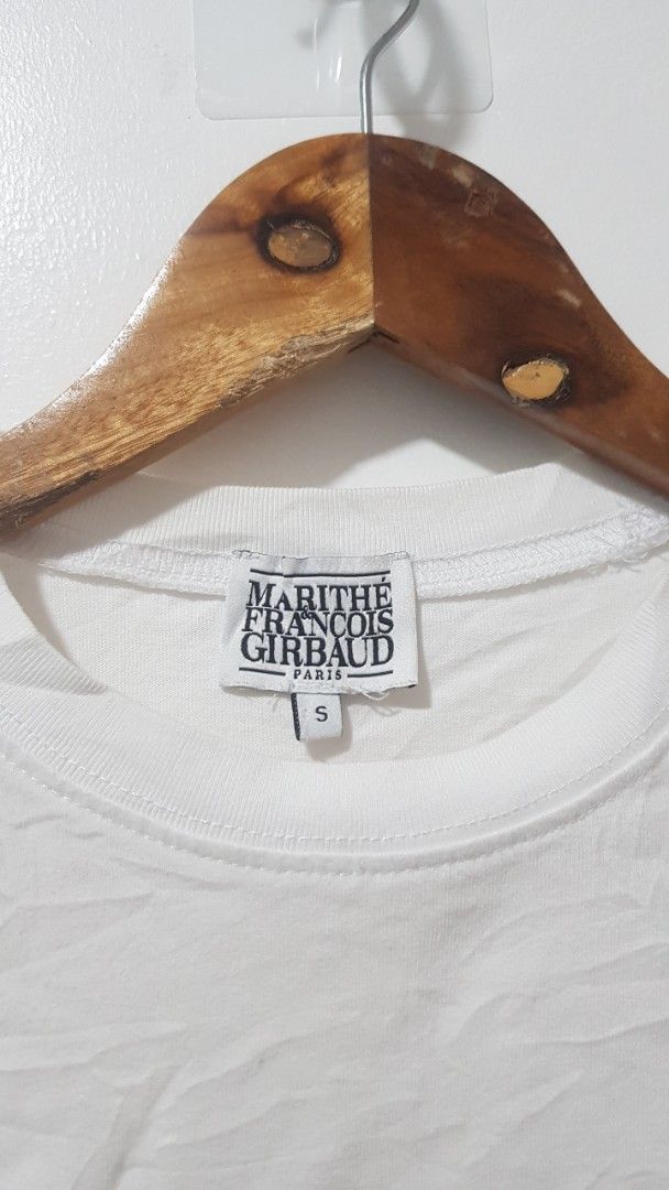 Marithe Francois Girbaud Paris White T-Shirt Size S (Category: Shirts) located in Manila. Submitted by nice430 (Listing ID 1467295948, Image 2). Description: - Brand: Marithé François Girbaud - Color: Clean White with Bold Black Box Logo - Size: S (Best fit for height: 155-160cm, Bust: 80-86cm) - Material: 100% Premium Cotton - Design: Classic crew neck, short sleeves - Condition: Brand new with interior brand tags and care label - Style: Versati