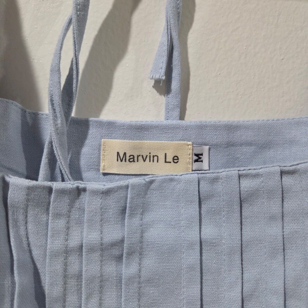 Marvin Le Light Blue Pleated Top Size M (Category: Sleeveless) located in San Nicolas. Submitted by mllc523 (Listing ID 1467198710, Image 2). Description: Brand: Marvin Le from Vietnam Size: Medium, bust up to 34" Color: Yellow Details: Textured fabric, unique tie-back straps with skinny loops, elegant pleats, with side zipper Condition: Very clean, no stains or flaws I have another piece in color yellow, same size and condition, price can be neg