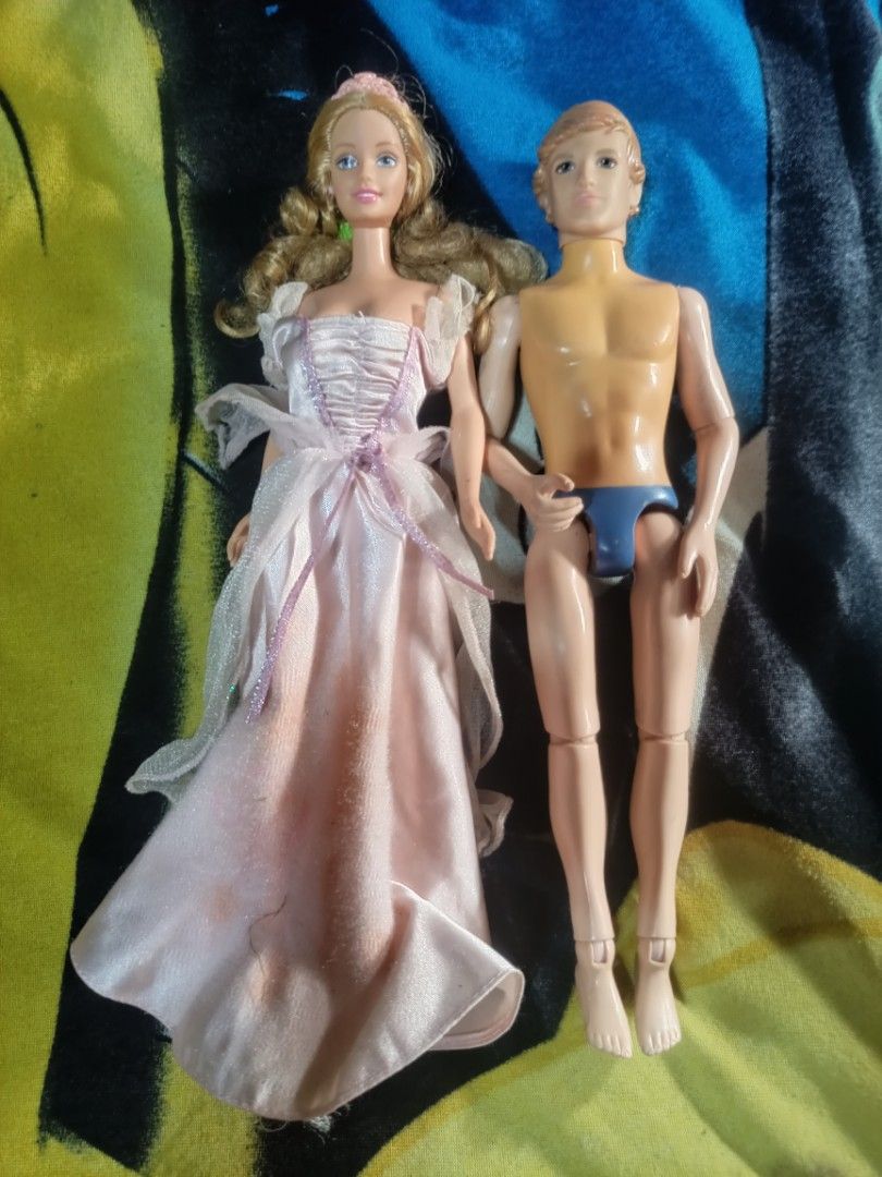 Mattel Barbie and Ken Doll Set (Category: Kids Toys) located in Cavite. Submitted by ronniel0943882 (Listing ID 1467240911, Image 1). Description: - Barbie & Ken doll set for collectors or custom projects - Barbie wears a pink satin ballgown with tulle layers and blonde styled hair (note: noticeable stains on the front skirt) - Ken features molded blue swim trunks and articulated joints - Markings: Mattel 1966 on Barbie's lower back, Toy Factory 