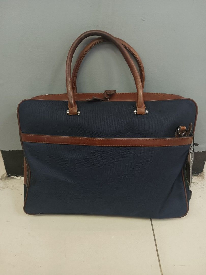 Maverick & Co. Navy Blue and Brown Leather Briefcase (Category: Briefcases) located in Quezon City. Submitted by arvietekto (Listing ID 1467274448, Image 1). Description: Maverick & Co. Briefcase Double-layer briefcase excellent condition excellent materials excellent quality affordable just message me for additional information and deals. Waterproof and scratch-resistant nylon fabric Internal structure Two metal zipper main compartments The padd
