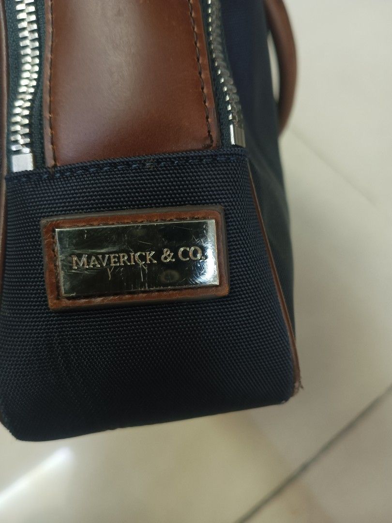 Maverick & Co. Navy Blue and Brown Leather Briefcase (Category: Briefcases) located in Quezon City. Submitted by arvietekto (Listing ID 1467274448, Image 2). Description: Maverick & Co. Briefcase Double-layer briefcase excellent condition excellent materials excellent quality affordable just message me for additional information and deals. Waterproof and scratch-resistant nylon fabric Internal structure Two metal zipper main compartments The padd