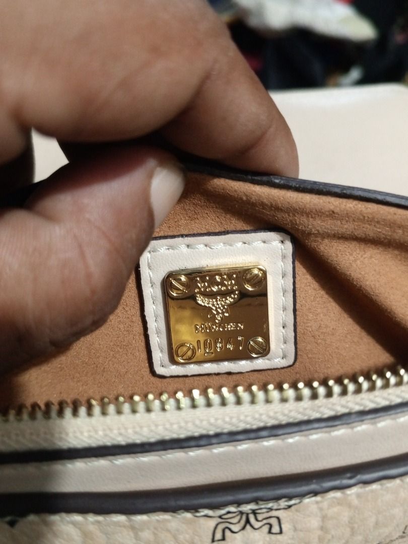 MCM Monogram Chain Crossbody Bag (Category: Luxury Bags & Wallets) located in Caloocan City. Submitted by goldendragon_b05555 (Listing ID 1467362138, Image 3). Description: - Authentic MCM crossbody bag with classic monogram print - Elegant gold-tone chain strap and secure front lock closure - Spacious interior featuring a convenient zip pocket - Includes metal logo plate stamped with Munich and serial numbers - Features interior cloth brand tag 