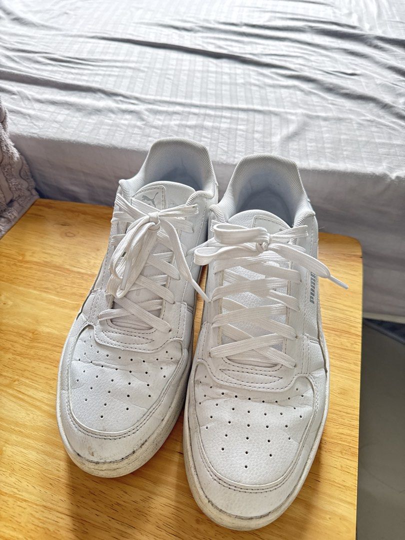 Men Puma White Sneakers Size US 9 (Category: Sneakers) located in Mandaluyong City. Submitted by uol77 (Listing ID 1467173983, Image 1). Description: - Brand/Model: Puma Low-Top Sneakers - Style: Classic court style with perforated toe box - Color: White (includes white laces and rubber soles) - Size: US 9 / EUR 42 / UK 8 - Condition: Minor scuffs on soles and upper from normal wear, still plenty of life left - Deal: Ready to ship, perfect for da