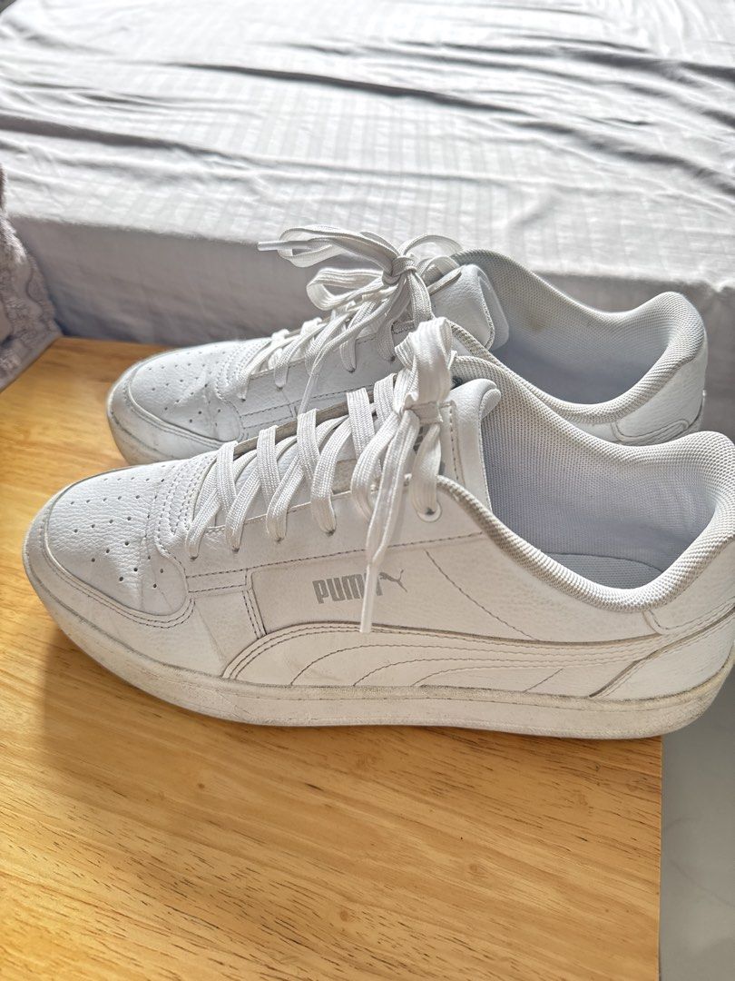 Men Puma White Sneakers Size US 9 (Category: Sneakers) located in Mandaluyong City. Submitted by uol77 (Listing ID 1467173983, Image 2). Description: - Brand/Model: Puma Low-Top Sneakers - Style: Classic court style with perforated toe box - Color: White (includes white laces and rubber soles) - Size: US 9 / EUR 42 / UK 8 - Condition: Minor scuffs on soles and upper from normal wear, still plenty of life left - Deal: Ready to ship, perfect for da