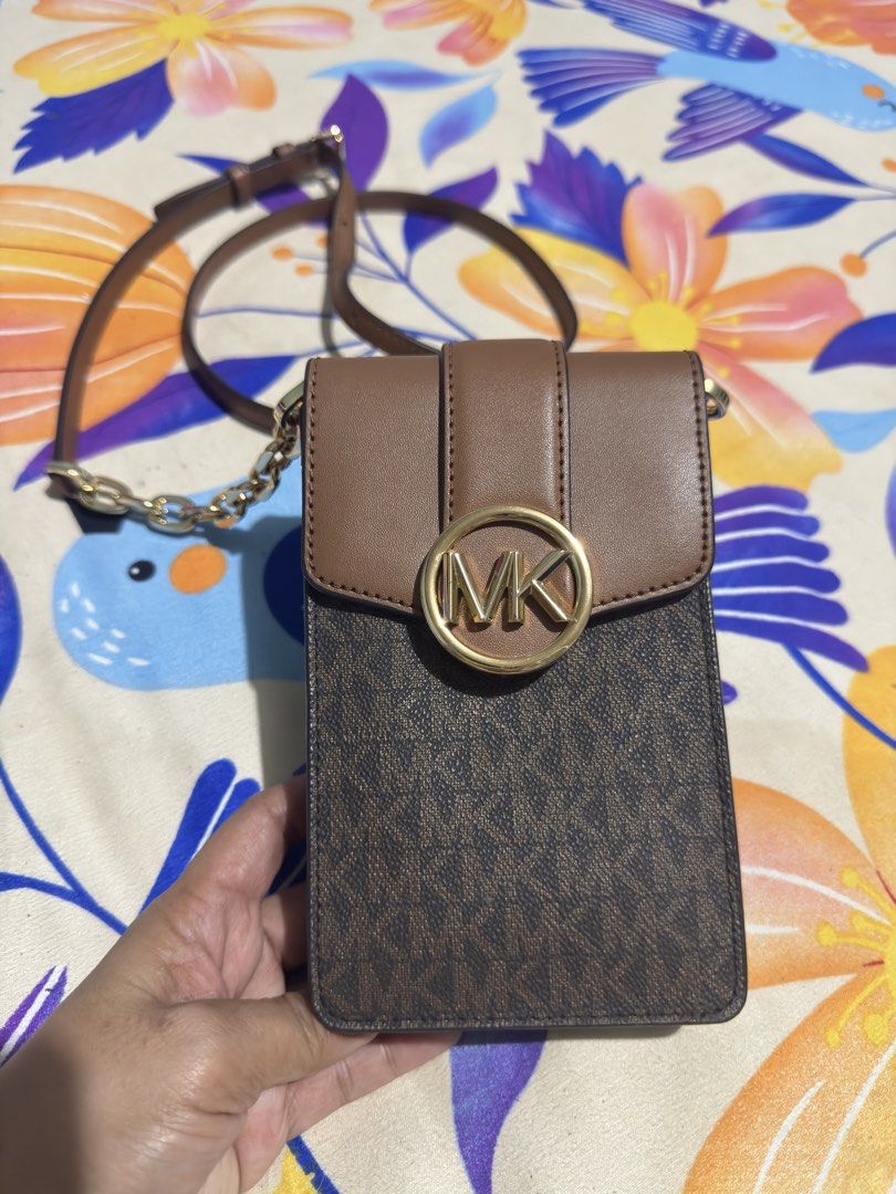 Michael Kors Brown MK Monogram Phone Crossbody Bag (Category: Luxury Bags & Wallets) located in Manila. Submitted by piayee (Listing ID 1467275021, Image 1). Description: - Authentic Michael Kors phone crossbody bag - Brown monogram print with solid brown leather flap - Elegant gold-tone hardware with prominent MK circle logo snap closure - Secure magnetic snap main closure and inner snap button - Adjustable brown leather strap featuring stylish 