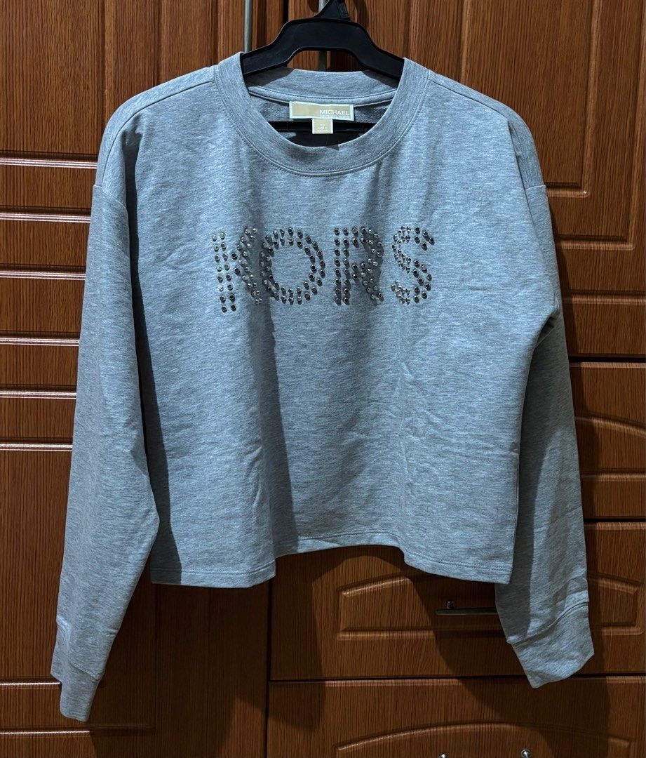 Michael Kors Grey PullOver XS - Semi Large (Category: Longsleeves) located in Quezon City. Submitted by garagesale2026 (Listing ID 1467356601, Image 1). Description: - Used once - In very good condition - Original from US - Runs big, XS on tag, fits up to Semi-Large.