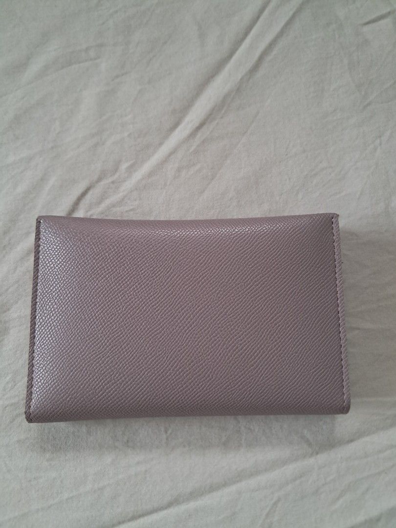 MICHAELA Wallet (Category: Wallets & Card holders) located in Valenzuela. Submitted by famsbest (Listing ID 1467230838, Image 2). Description: - MICHAELA lilac wallet - Premium textured faux leather - Closure: Secure snap button - With multiple card slots, clear ID window, and spacious cash compartment - Lightly used.