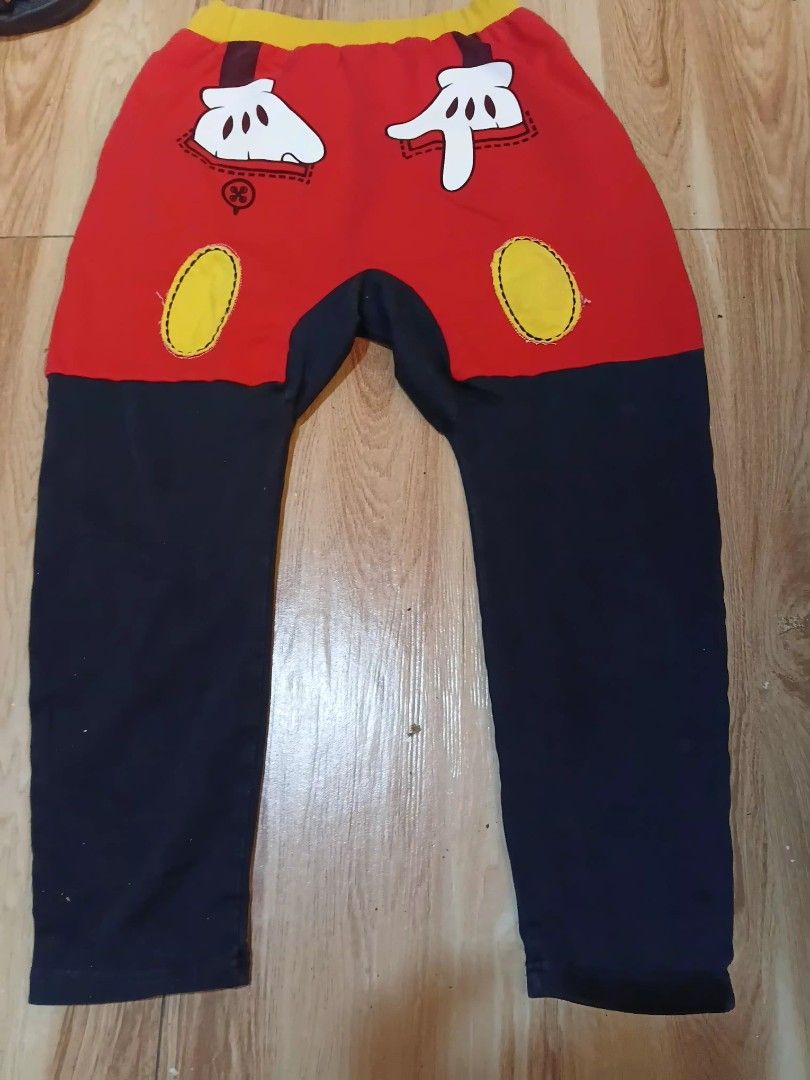 Mickey Mouse Kids Pants Size 140/69 (Category: Babies & Kids Fashion) located in Manila. Submitted by cami1914 (Listing ID 1467326500, Image 2). Description: - Fun Mickey Mouse color block pants for kids - Vibrant red and dark blue design with a bright yellow waistband - Features a large Mickey face graphic on the front - Includes cute glove and button details on the back - Size: mini pink 140/69 - Perfect for Disney trips, parties, or everyday w