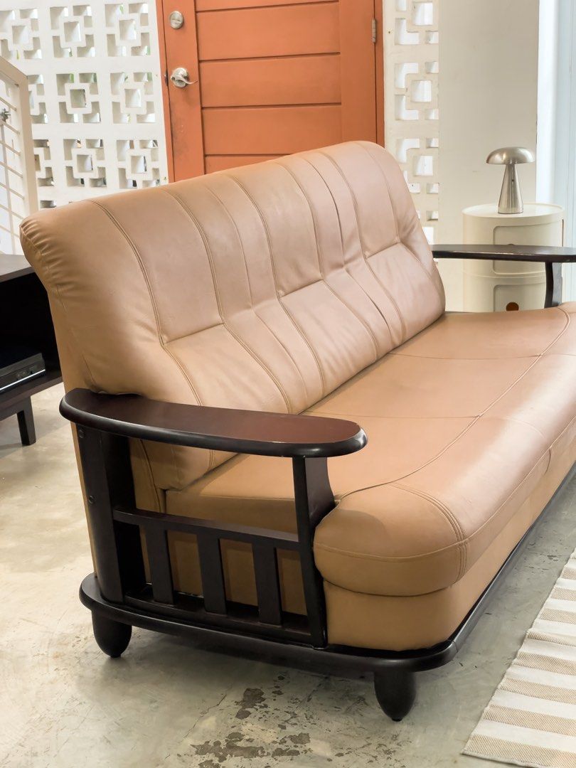 Midcentury sofa set (Category: Sofas) located in Rizal. Submitted by lori6848 (Listing ID 1467257092, Image 3). Description: - Set includes: Matching sofa and swivel lounge armchair - Style: Mid-century modern with clean lines - Color/Material: Neutral beige upholstery with dark wooden frames and armrests - Comfort: Thick, plush cushions ideal for lounging - Build: Solid construction with sturdy wooden legs - Ideal for: Living rooms or cozy loung