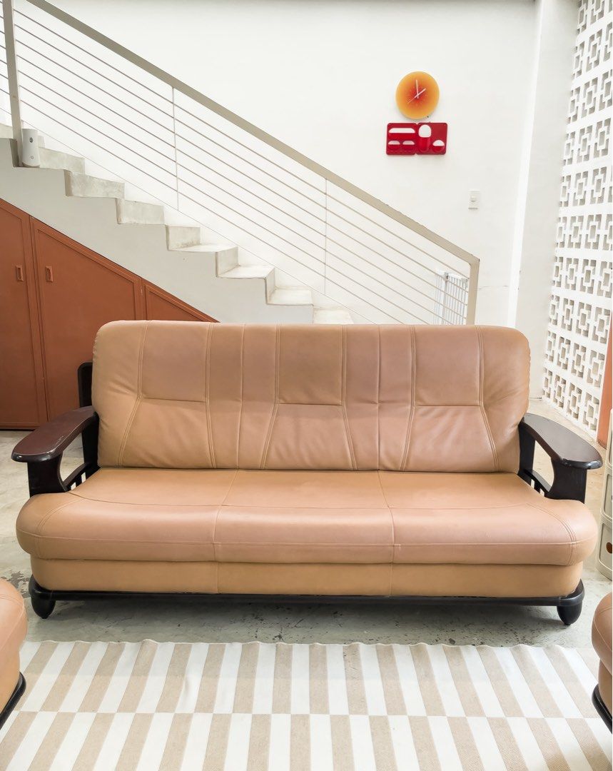 Midcentury sofa set (Category: Sofas) located in Rizal. Submitted by lori6848 (Listing ID 1467257092, Image 2). Description: - Set includes: Matching sofa and swivel lounge armchair - Style: Mid-century modern with clean lines - Color/Material: Neutral beige upholstery with dark wooden frames and armrests - Comfort: Thick, plush cushions ideal for lounging - Build: Solid construction with sturdy wooden legs - Ideal for: Living rooms or cozy loung