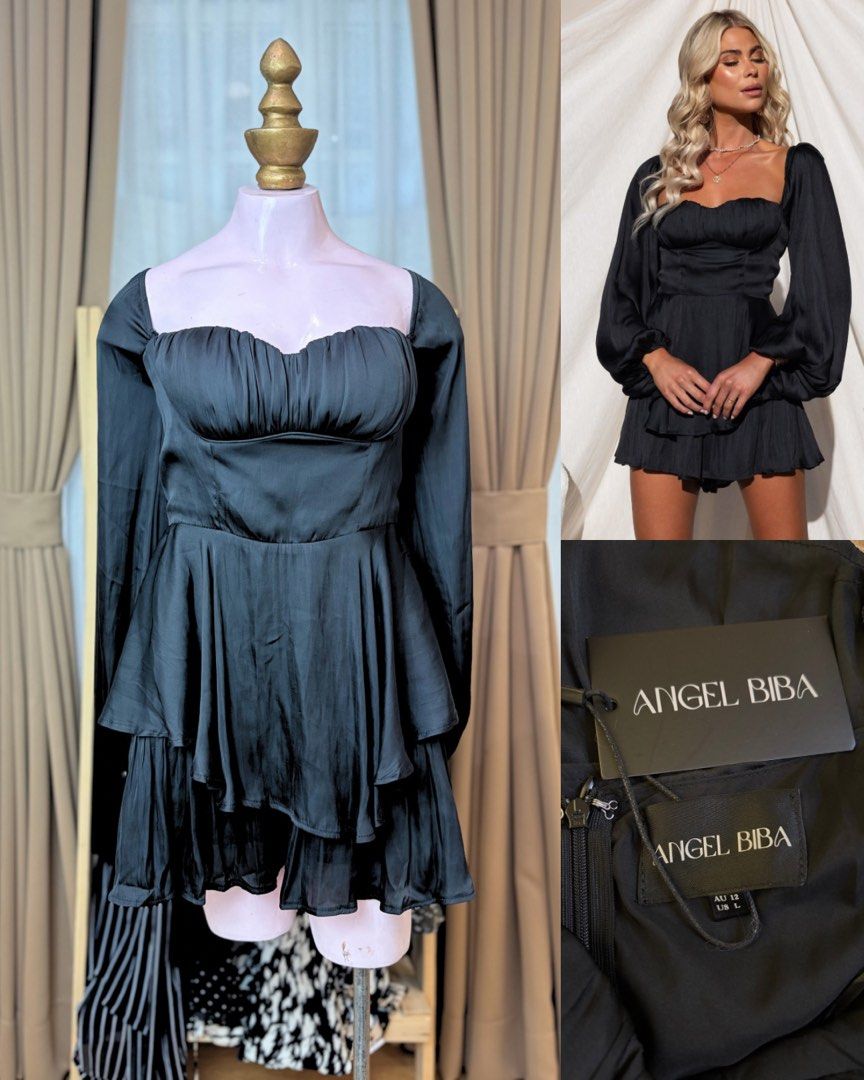 Midnight Satin Romper (Category: Dresses) located in Batangas. Submitted by nicki0001 (Listing ID 1467242614, Image 1). Description: - Brand: Angel Biba - Color: Black - Size: AU 12 / US L (Tag attached) - Neckline: Sweetheart - Sleeves: Long balloon sleeves - Design: Ruched bodice with a double-layered tiered ruffled skirt - Closure: Invisible back zip - Built in inner shorts - Condition: Brand new with tags.
