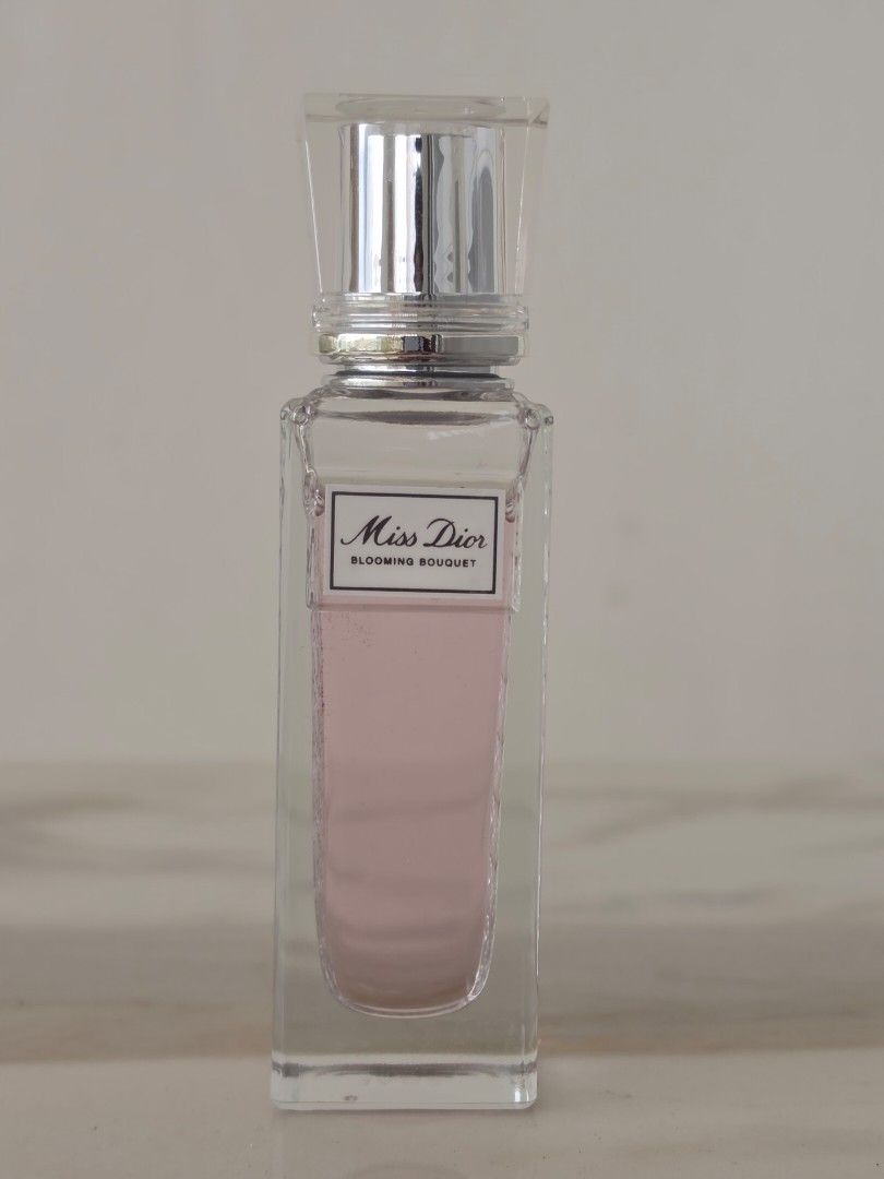 Miss Dior Blooming Bouquet 20ml (Category: Fragrance & Deodorants) located in Manila. Submitted by viannedeclutters (Listing ID 1467219080, Image 1). Description: - Authentic Miss Dior Blooming Bouquet Travel Rollerball Edition Perle de Parfum - Size: 20ml (glass bottle with iconic houndstooth pattern) - Silver cap with engraved CD logo - Condition: Practically full, used very few times - Scent profile: Fresh, floral, and elegant - Perfect for da
