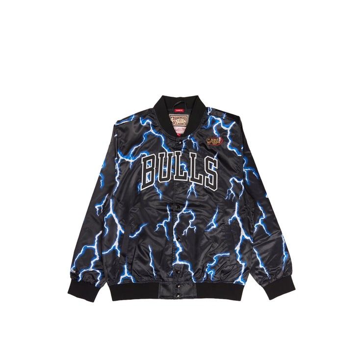 Mitchell & Ness Chicago Bulls Lightning Satin Bomber Jacket (Category: Coats, Jackets and Outerwear) located in Manila. Submitted by capusojohn43359 (Listing ID 1467180281, Image 1). Description: - Brand: Mitchell & Ness (Hardwood Classics) - Team: Chicago Bulls - Design: Black satin with striking blue and white lightning bolt print - Details: Embroidered chest lettering and wrist cuff branding - Style: Button-up front closure, side pockets, and 