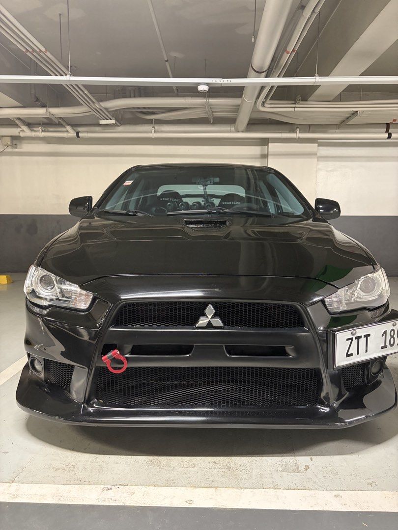 Mitsubishi Lancer 2.0 EX GT MIVEC 5MT Auto (Category: Used Cars) located in Las Pinas. Submitted by paulbp (Listing ID 1467326905, Image 1). Description: Mitsubishi Lancer EX 2.0 CVT Paddle shifters 18 inch Mags original Enkei Raijin with bridgestone tires Evo body kits stage 21 Carbon fiber hood painted black K & N filters Bride racing seats Ceramic coated by Aegis detailing .
