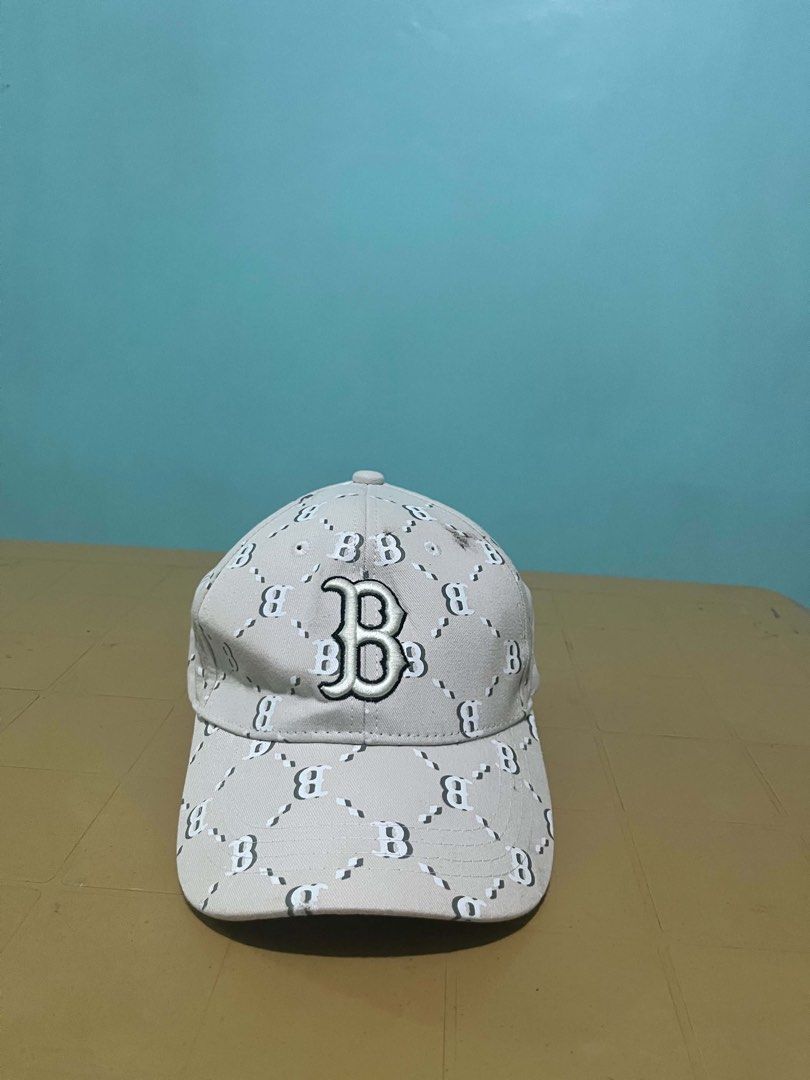 MLB Boston Red Sox Monogram Cap Hat (Category: Caps & Hats) located in Lapu Lapu. Submitted by trip-thrift (Listing ID 1467288033, Image 1). Description: - Authentic MLB Boston Red Sox cap in a stylish beige color - All-over monogram pattern with embroidered team logo in front - Classic six-panel construction with embroidered eyelets for breathability - Standard curved brim for sun protection and a classic look - Adjustable strapback closure fitt