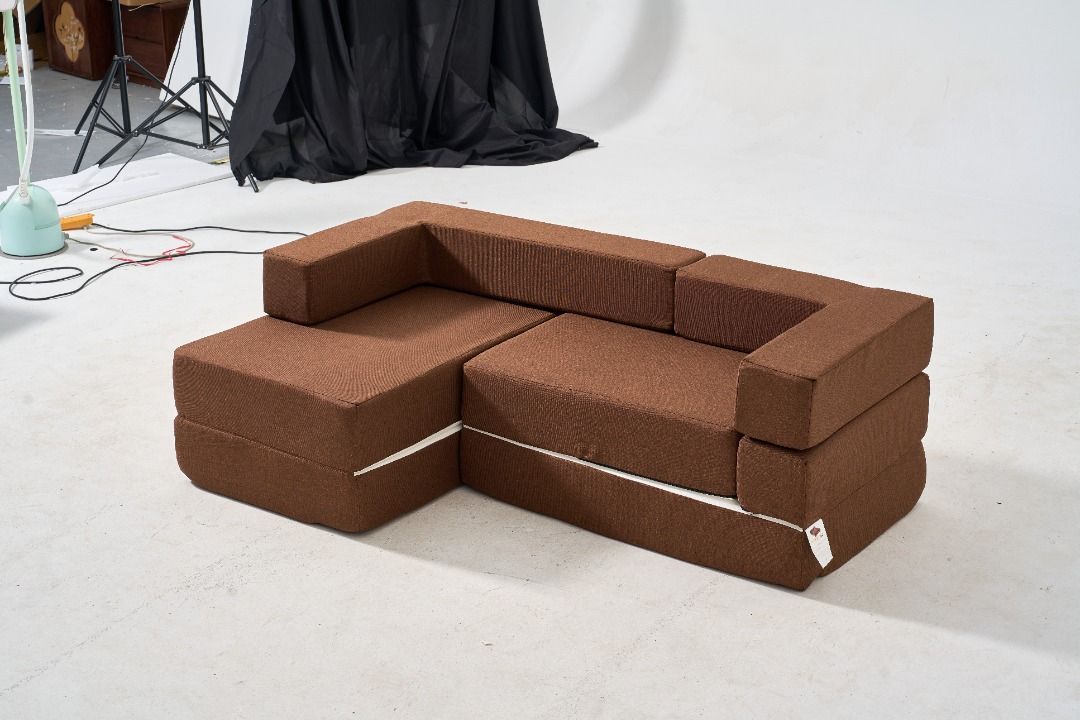 Modern modular sofa foam couch (Category: Sofas) located in Manila. Submitted by rarewhale_487098 (Listing ID 1467206391, Image 2). Description: - Textured solid fabric modular corner sofa - Easily rearrangeable modular sections to fit your space - Thick foam cushioning for firm and comfortable support - Neutral earth tone that complements living rooms or studies - Compact size, ideal for smaller apartments and studio spaces.