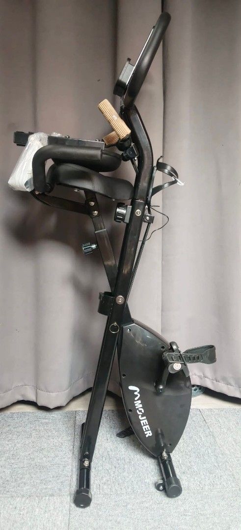 Mojeer Foldable Magnetic Exercise Bike (Category: Cardio & Fitness Machines) located in Valenzuela. Submitted by gracebacot17959 (Listing ID 1467211422, Image 2). Description: - Authentic Mojeer magnetic exercise bike imported from Japan (Sleek black finish) - Space-saving foldable design, perfect for home workouts - Built-in resistance bands for upper body training - LCD monitor tracks time, speed, distance, and calories - Comfortable padded sea