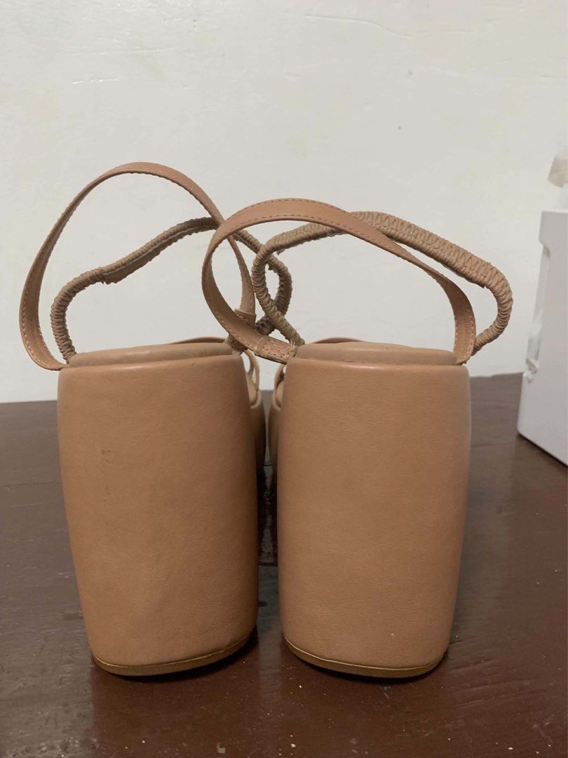 Beige Wedge Sandals Size 10W (wide) (Category: Wedges) located in Borongan. Submitted by kabes_jane (Listing ID 1467188496, Image 3). Description: - Brand: Moleca - Color: Nude beige with a contrasting cream stripe - Style: Two-strap front design with an elasticized slingback strap for easy slip-on - Heel: Comfortable chunky platform wedge for extra height - Details: Branded Moleca logo stamped on the insoles.