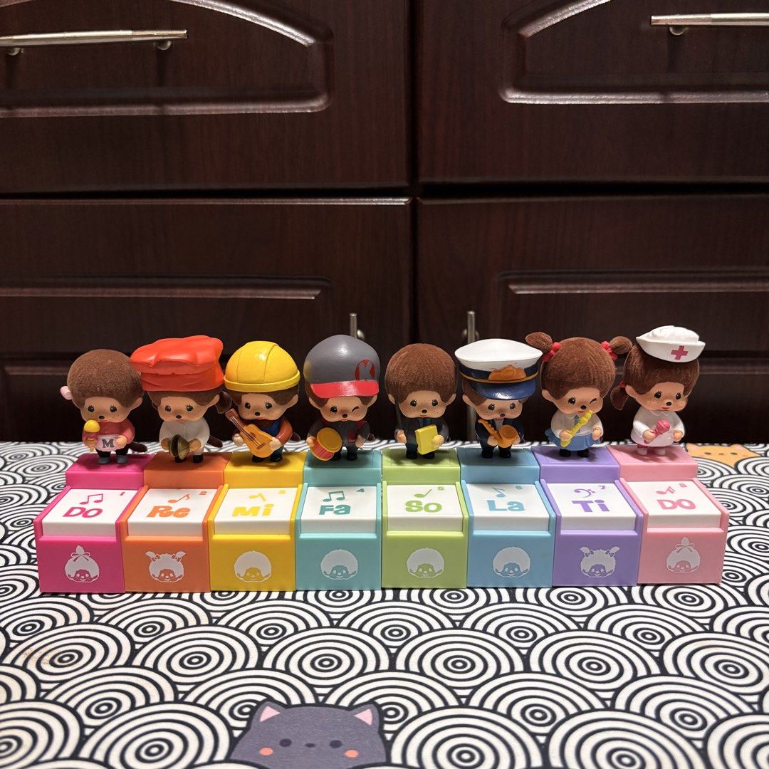 Monchhichi Musical Band Figures Complete Set (Category: Figurines & Statues) located in Manila. Submitted by nero.ph (Listing ID 1467323356, Image 1). Description: - Complete set of 8 adorable Monchhichi musical figures - Features characters holding various instruments (microphone, cymbals, guitar, drum, and more) - Stands on colorful interlocking blocks representing the musical scale (Do to Do) with cute outlines and note names - Built-in musica
