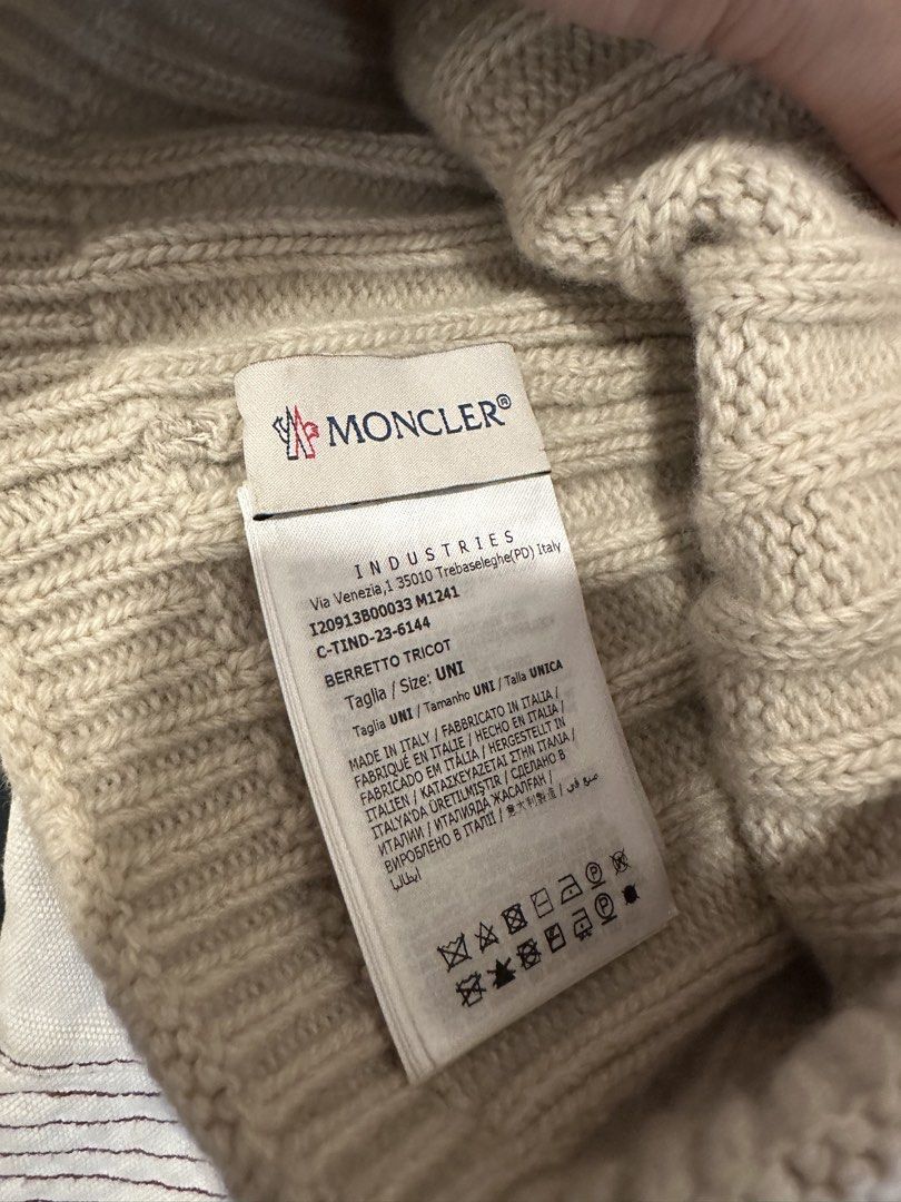 Moncler Ribbed Wool Beanie Hat Beige (Category: Coats, Jackets and Outerwear) located in Makati City. Submitted by hehehekdeg (Listing ID 1467247070, Image 2). Description: - Authentic Moncler ribbed knit beanie in a versatile beige color - Made from 100% premium wool for ultimate warmth - Features a stylish brown leather Moncler logo patch on the front cuff - Size: UNI (One Size fits most) - Condition: Brand new with clean tags attached - Perfec