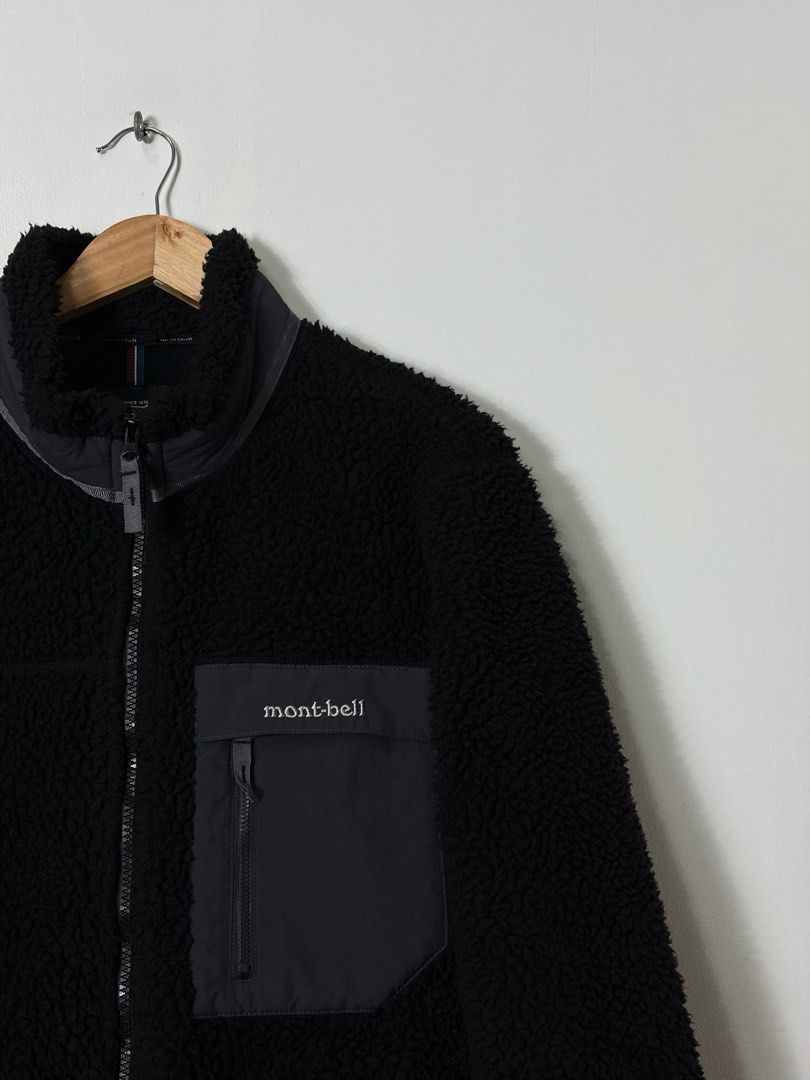 MONTBELL BOA HIGH PILE SHERPA JACKET (Category: Coats, Jackets and Outerwear) located in Cavite. Submitted by frankiemnla (Listing ID 1467325952, Image 2). Description: L- 27 W- 22 Size- M to L Like new condition • Chest Pocket: A contrasting matte-finish, dark grey zippered utility pocket on the left chest with embroidered branding. • Sleeve Patch: A circular, retro-styled adventure mountain emblem stitched onto the right upper sleeve. • Trim Ac