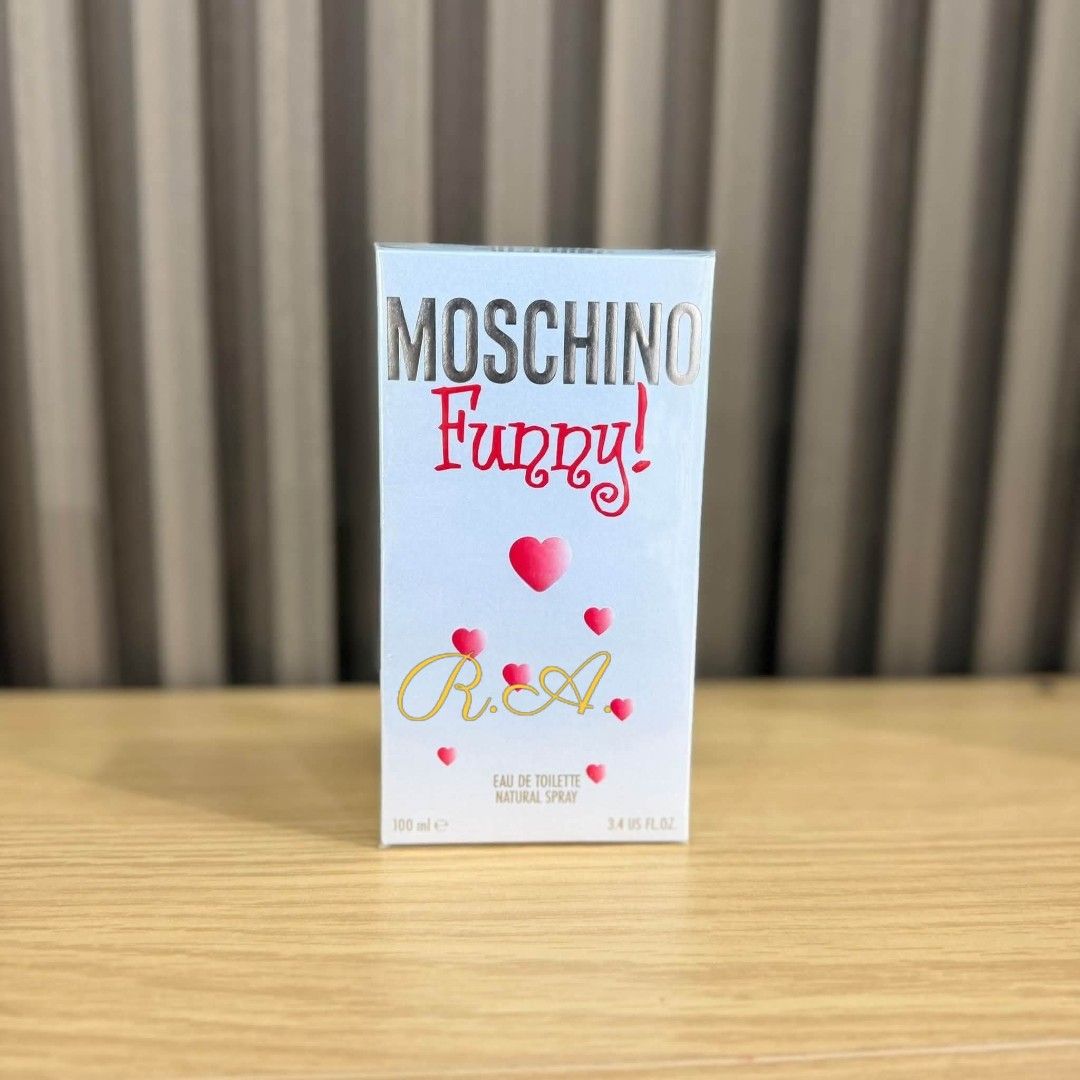 Moschino Funny Eau de Toilette 100ml (Category: Fragrance & Deodorants) located in Manila. Submitted by rhona30antiquera (Listing ID 1467305499, Image 1). Description: - Item: Moschino Funny! Eau de Toilette - Size: 100ml Natural Spray - Condition: Brand new, never opened or sprayed, comes in box - Scent Profile: Fun, playful, and great for everyday wear - Packaging: Adorable design covered in little red hearts - Perfect Gift Idea: Ready for gift