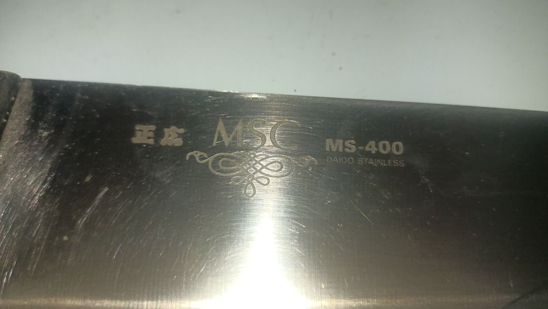 MSC MS-400 Stainless Steel Kitchen Knife (Category: Knives & Chopping Boards) located in Munoz. Submitted by larryc1212 (Listing ID 1467317835, Image 3). Description: - Brand: MSC (Model MS-400) - Blade: Sharp stainless steel, approx. 162 mm - Total Length: Approx. 288 mm - Handle: Dark riveted wooden handle with solid grip Disclaimer: Item may include some scratches due to age, as is were is basis Item can be pick up in our Japan surplus shop lo