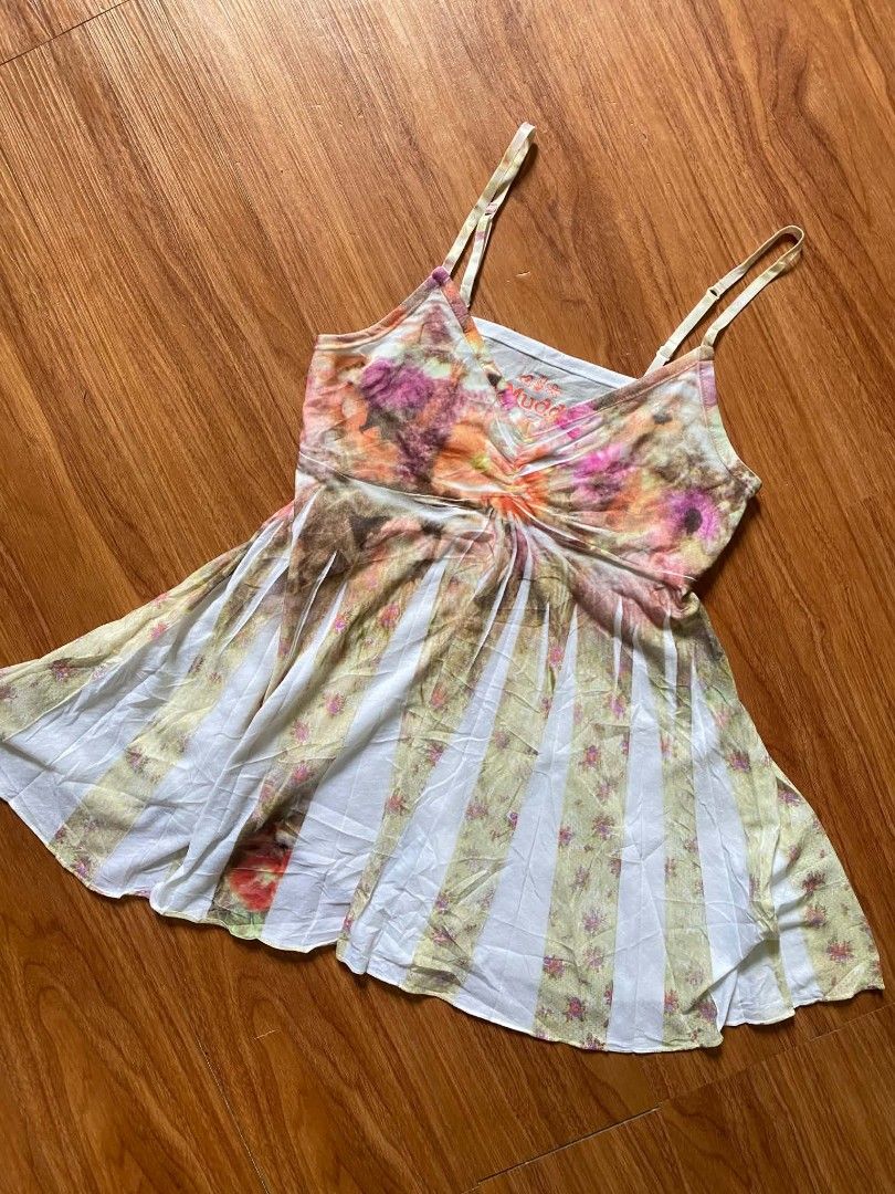 Mudd Floral Tie-Dye Cami Tank Top (Category: Sleeveless) located in Malasiqui. Submitted by finnley26 (Listing ID 1467239144, Image 1). Description: - Brand: Mudd - Style: V-neck cami top with adjustable straps and gathered center detail - Design: Flowy flared hem with alternate panels of white fabric and vintage floral tie-dye (yellow, orange, and pink hues) - Fabric: Super lightweight material - Best for: Summer days or easy layering - Conditio
