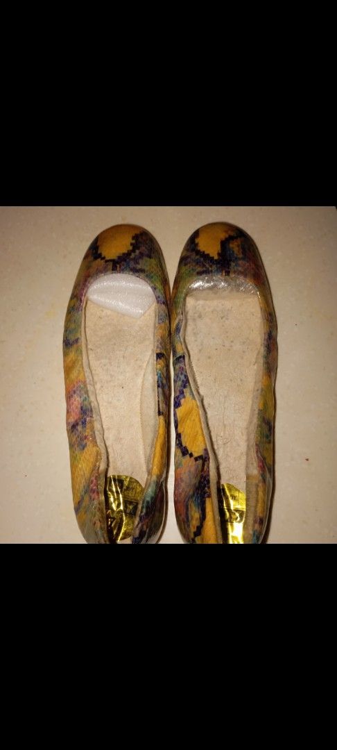 Multicolor Snake Print Ballet Flats (Category: Flats & Sandals) located in Mandaluyong City. Submitted by ilightcoproducts (Listing ID 1467339981, Image 1). Description: - Style: Slip-on flats with rounded toes - Design: Eye-catching multicolor snake print (yellow, blue, purple, and black) size - Comfort: Soft inner sizelining for all-day wear - Details: Gold metallic brand logo stamp on the heel insole - Condition: Brand new with original toe in